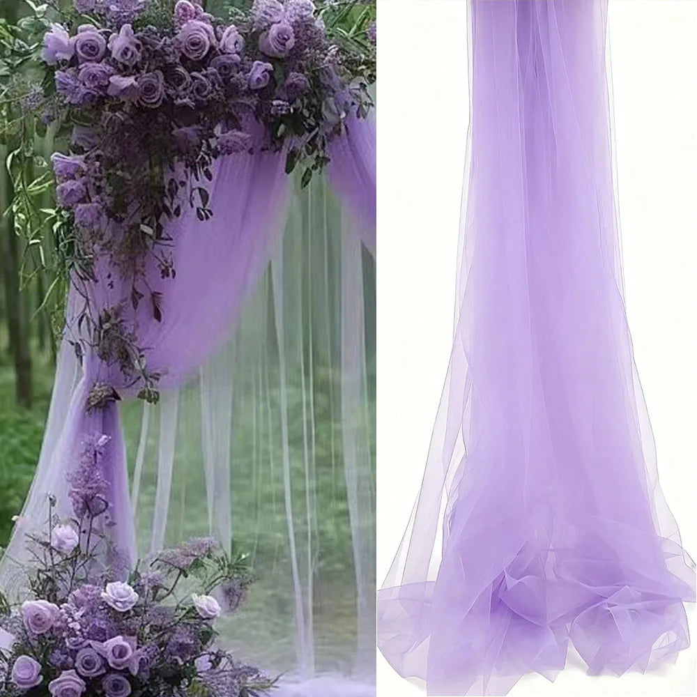 Purple sheer tulle draping fabric used as a wedding arch backdrop