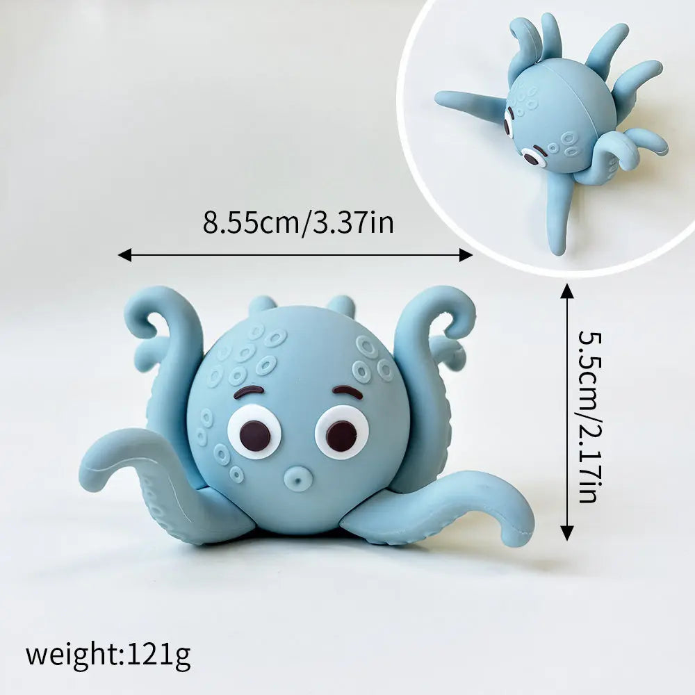 A light blue silicone ocean animal set featuring a whale, octopus, and turtle, shown with dimensions.