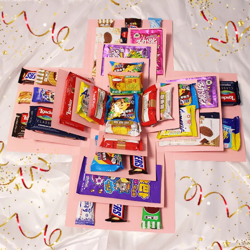 A pink gift box featuring various colorful party favors and packaging designs.