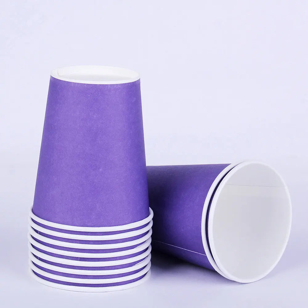 A stack of purple disposable cups with white rims, shown in a studio setting.