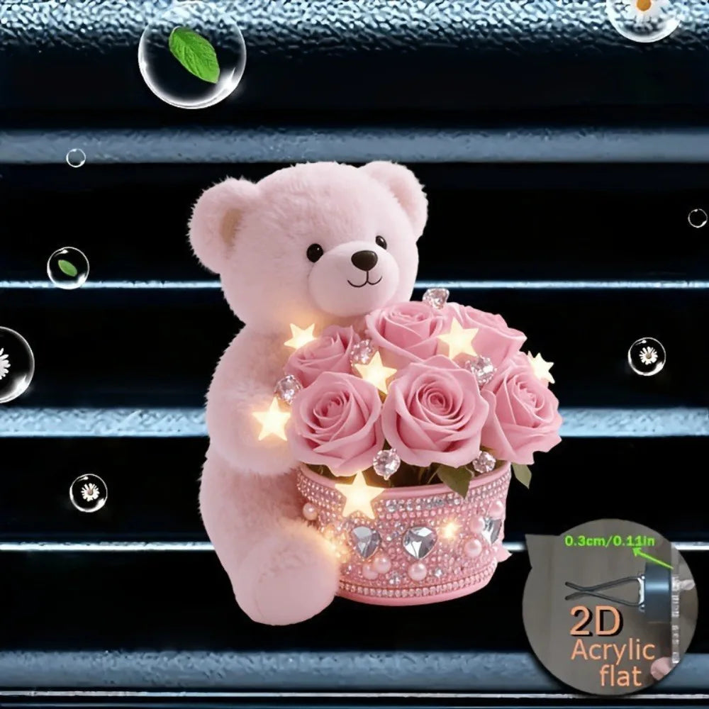 A pink fluffy teddy bear holding a bouquet of pink roses in a glittery pot, displayed on a blue textured surface.