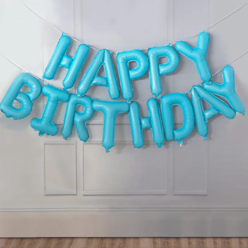 A string of light blue foil letter balloons spelling out Happy Birthday decoration for a party.