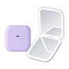 A purple portable folding LED makeup mirror with a reflective surface and a magnifying section.