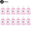Twelve pink aluminum foil baby bottle balloons with purple caps for baby shower decor