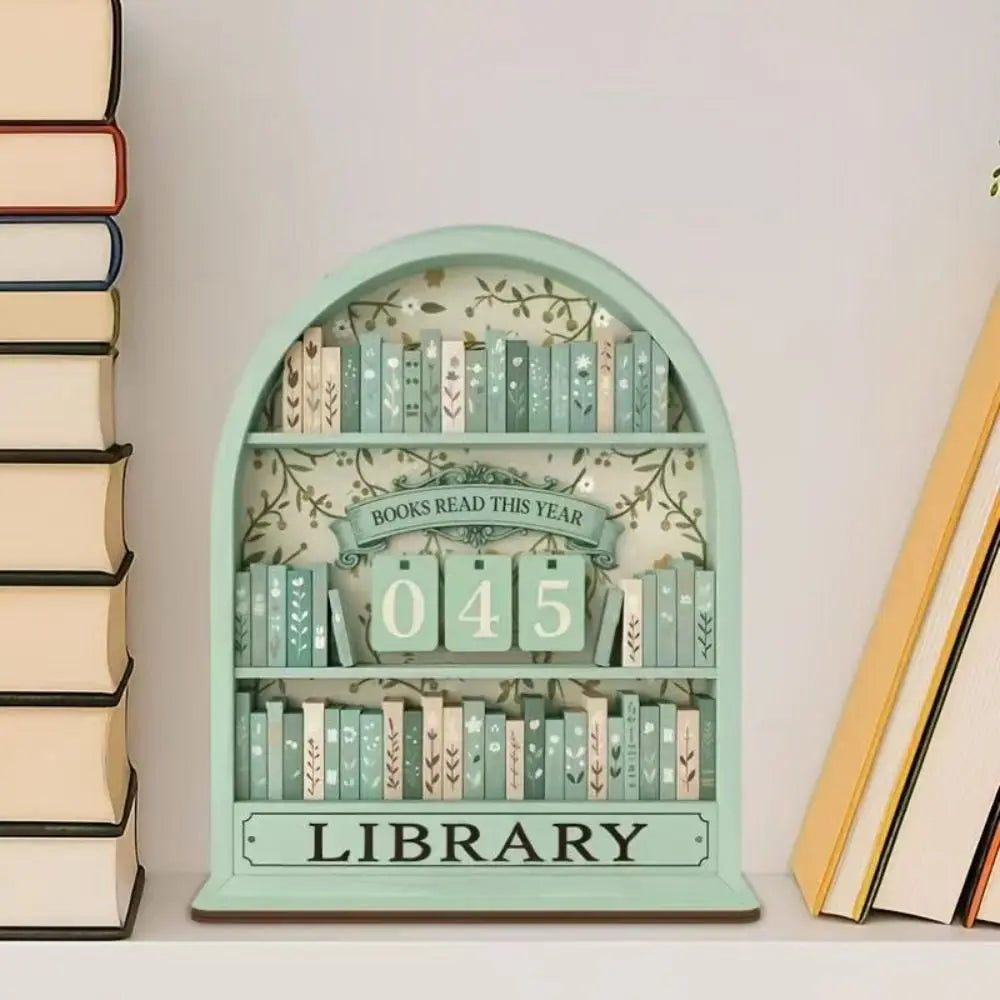 A light green wooden shelf displaying 45 books and a sign that reads Library