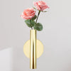 Modern wall-mounted flower vase with pink roses and gold finish