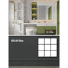 A modern bathroom or kitchen wall featuring marble-patterned decals and a green vanity area.