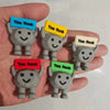 A hand holds five gray motivational stones, each with a yellow or green tag reading You Rock.