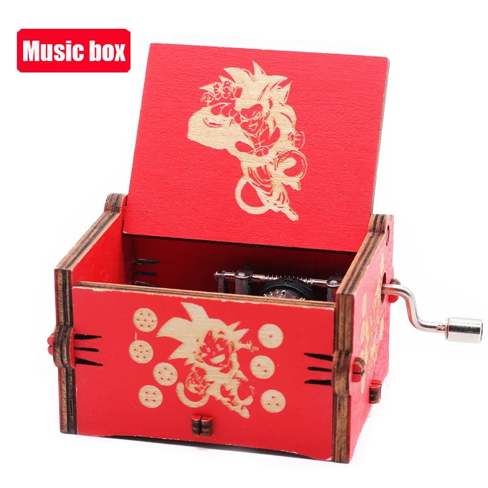 A red carved wooden music box with an open lid featuring a gold-colored floral design.