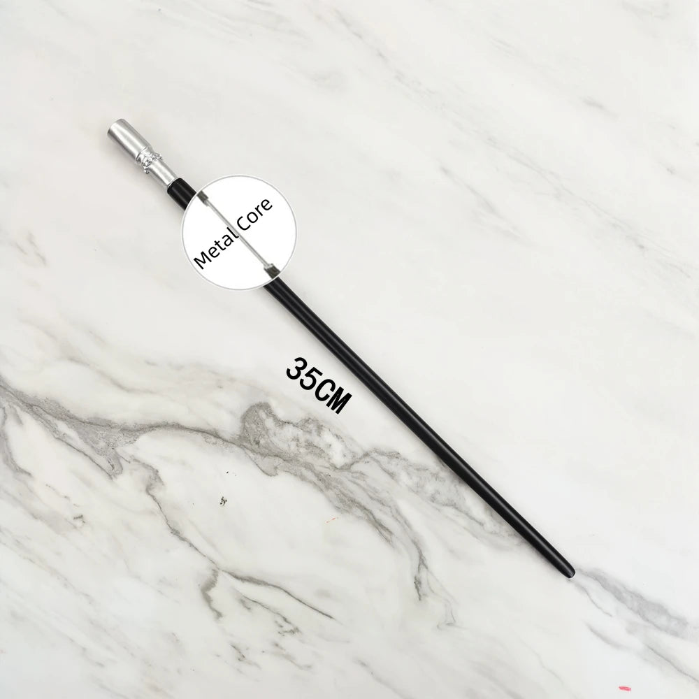A black metal magic wand replica with a silver tip and a circular label marked Metal Core lying on a white marble surface.