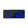 A black digital alarm clock displaying the time 13:06 with blue LED digits.