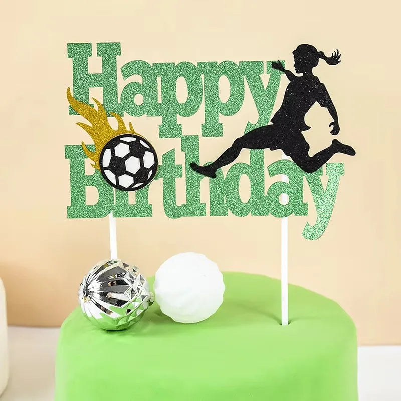 Green glitter birthday cake toppers featuring soccer players, a soccer ball, and a flame design.