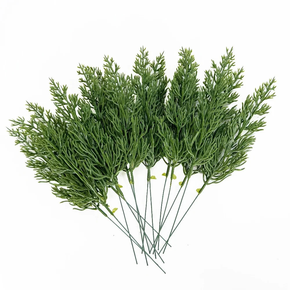 A bundle of artificial Christmas berry stems featuring green pine branches.