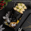 A demonstration picture showing a handcrafted soap rose bouquet inside a black box with a decorative rabbit figure.