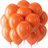 A cluster of bright orange latex balloons floating against a white background.
