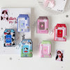 A collection of pink and green silicone photo keychains shaped like milk bottles, featuring various cartoon designs.