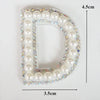 A white pearl letter D patch embellished with colorful rhinestones for clothing