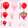 A set of various colored balloons including red and pink latex balloons and a strawberry shaped balloon