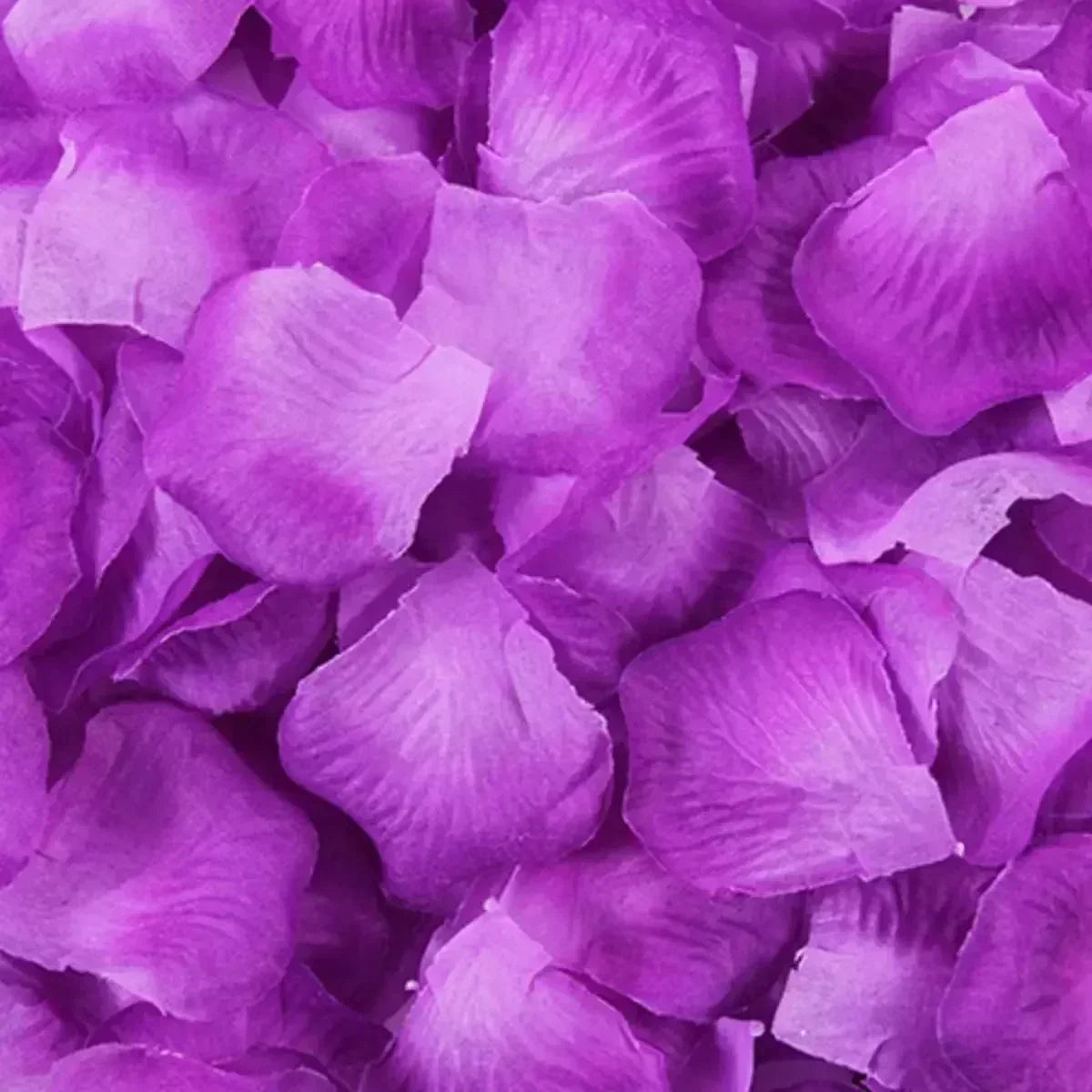 Purple artificial rose petals used for wedding decoration