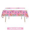 Pink and white striped tablecloth decorated with Cocomelon characters and balloons for a party