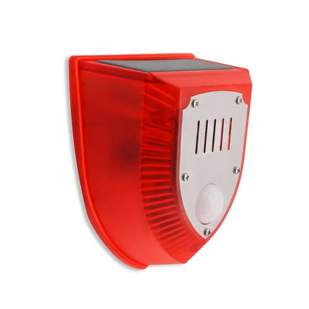 A red solar-powered motion sensor alarm with a flashing siren and ventilation grille.
