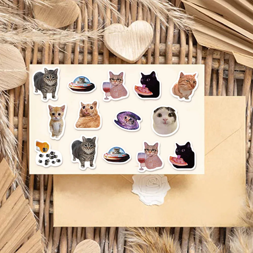 A collection of cartoon cat reward stickers featuring various cats in different poses and colors, displayed on a light brown 