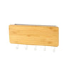 A light wood bamboo wall-mounted key rack with six hooks.
