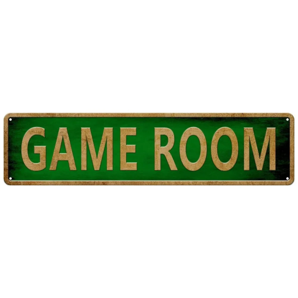 A rectangular green metal tin sign with the words GAME ROOM written in gold lettering.