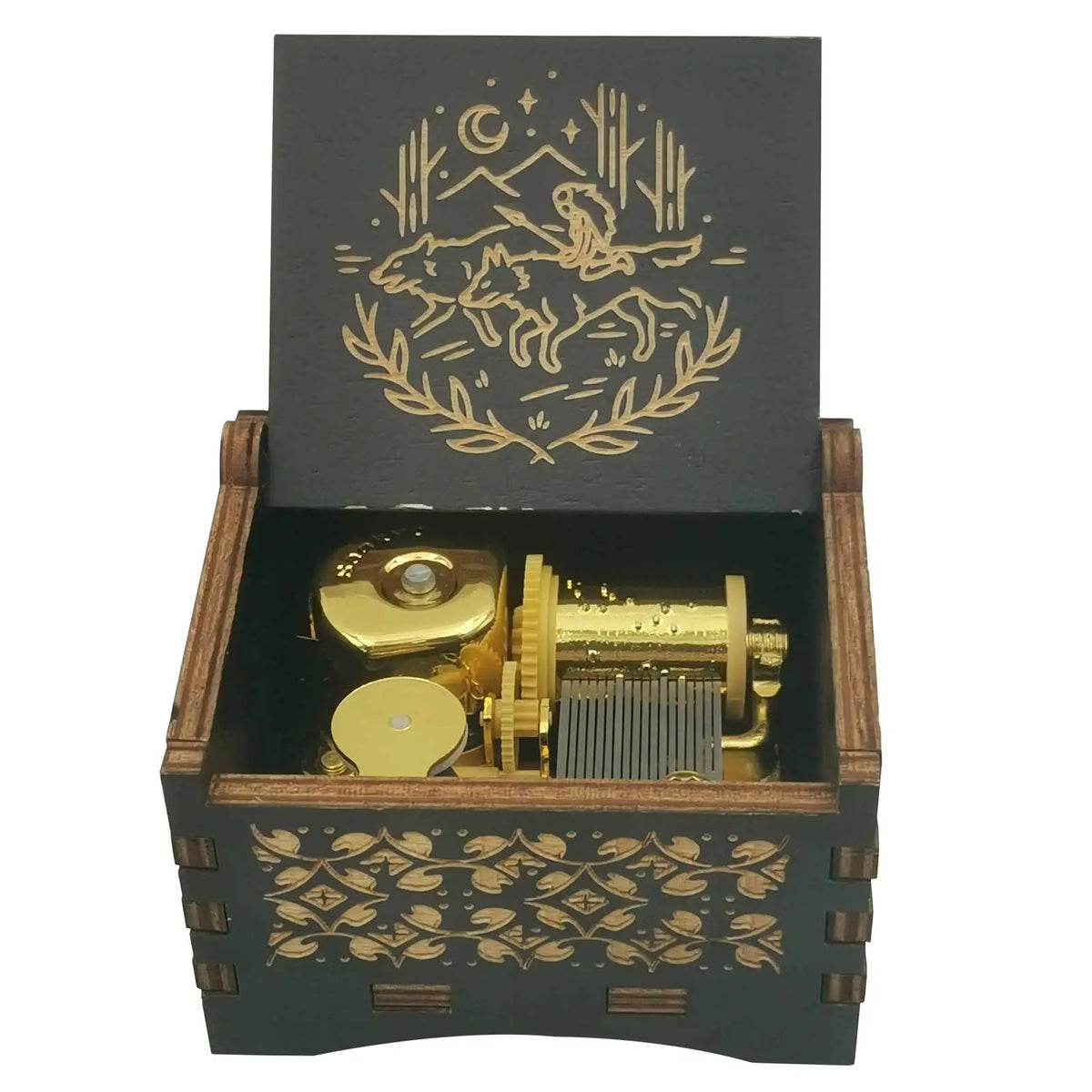 A dark wooden box containing a brass music box with an engraved design of a leaping animal and celestial elements.