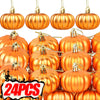 A collection of shiny orange pumpkin hanging ornaments for autumn and Halloween decoration