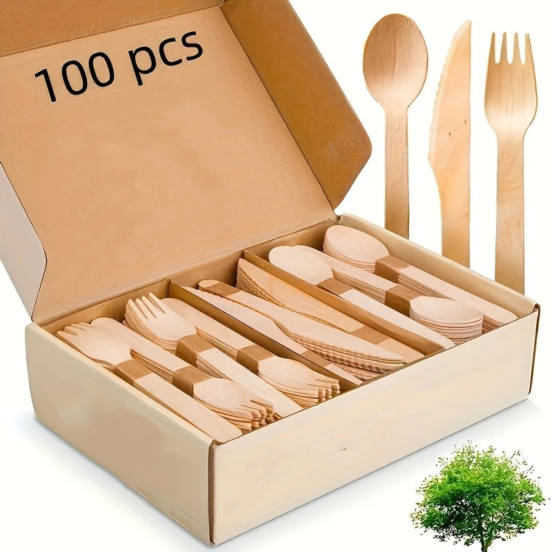 A cardboard box filled with 100 pieces of eco-friendly wooden cutlery including forks, knives, and spoons.