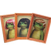 A set of three wooden photo frames featuring watercolor illustrations of frogs.