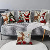 A set of four festive Christmas linen throw pillow covers featuring reindeer, a Christmas tree, Santa, and a snowman on a bla
