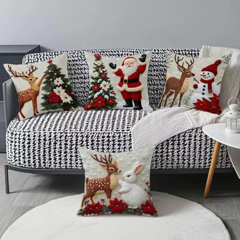 A set of four festive Christmas linen throw pillow covers featuring reindeer, a Christmas tree, Santa, and a snowman on a bla