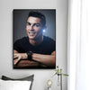 A modern wall art print featuring a portrait of Cristiano Ronaldo with a glowing light effect.