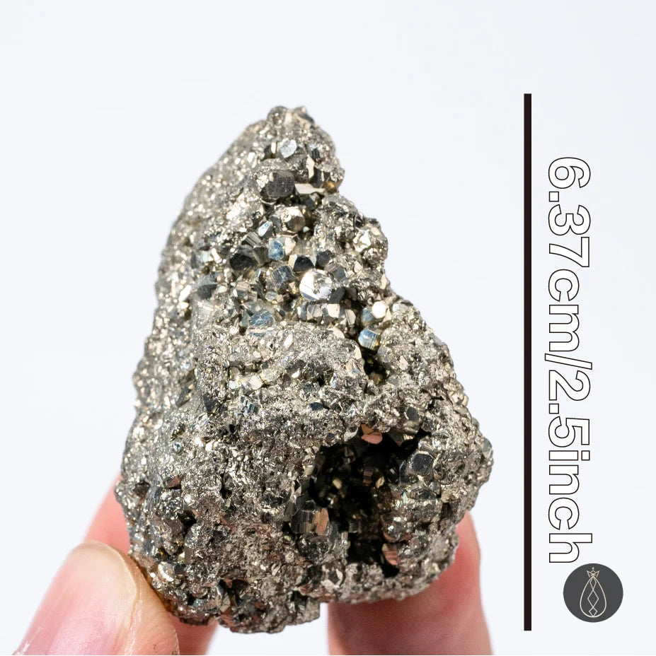 A rough, metallic gray natural pyrite crystal held in a hand against a white background.