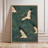 A framed canvas wall art featuring a Japanese crane in flight against a teal background.
