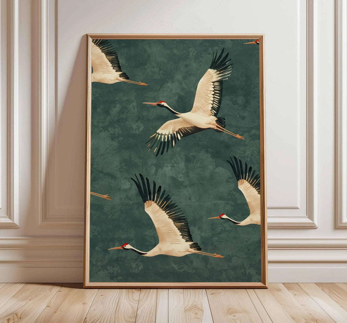A framed canvas wall art featuring a Japanese crane in flight against a teal background.