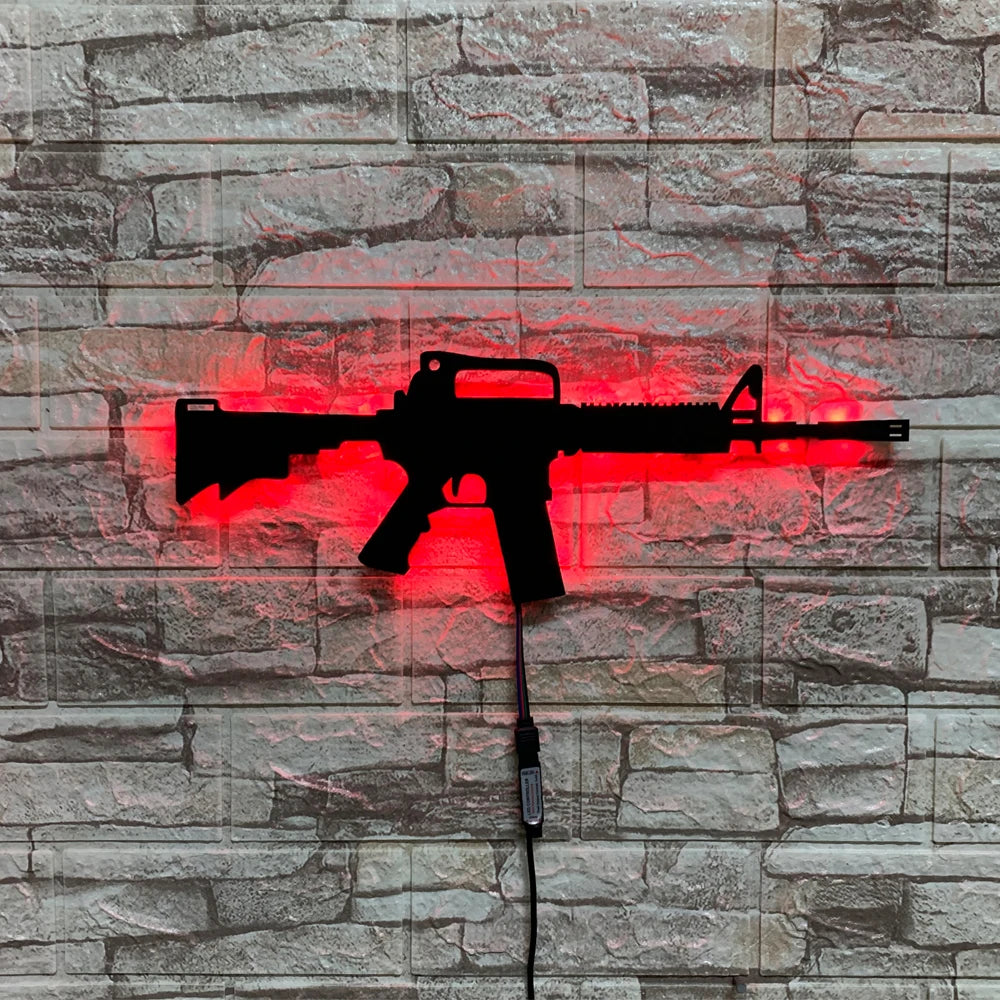 A red LED gun-shaped wall decor light mounted on a gray stone brick wall.
