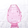 Vase décoratif en verre rose à forme de champignon avec surface texturée et petites bulles