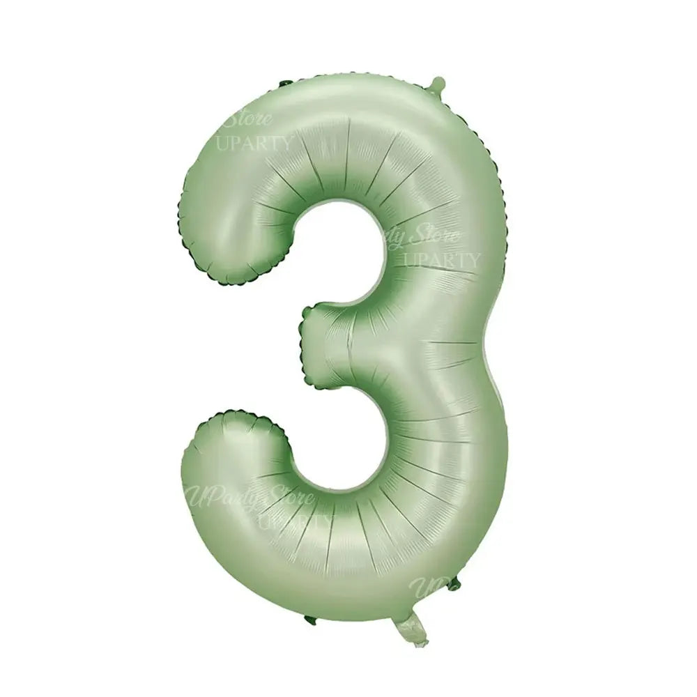 A large foil number three balloon in a light green color.