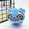 A blue tiger plush toy with white paws and stylized anime facial markings is displayed in a black wire cage.