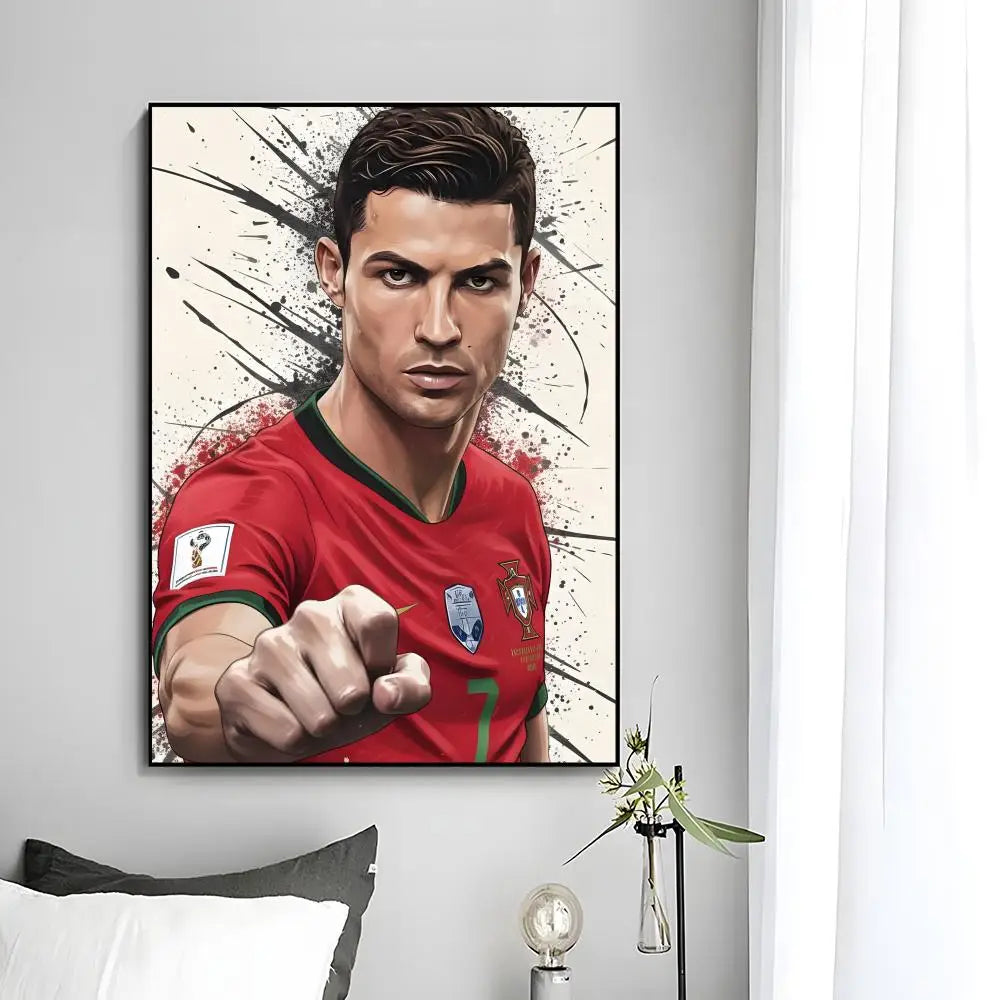 A modern wall art print featuring a close-up portrait of Cristiano Ronaldo in a red jersey with black paint splatters.