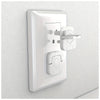 A white childproof electrical outlet plug with an easy-grip handle mounted on a wall.