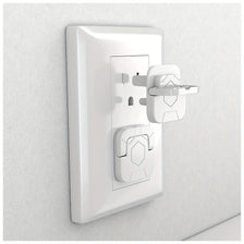 A white childproof electrical outlet plug with an easy-grip handle mounted on a wall.