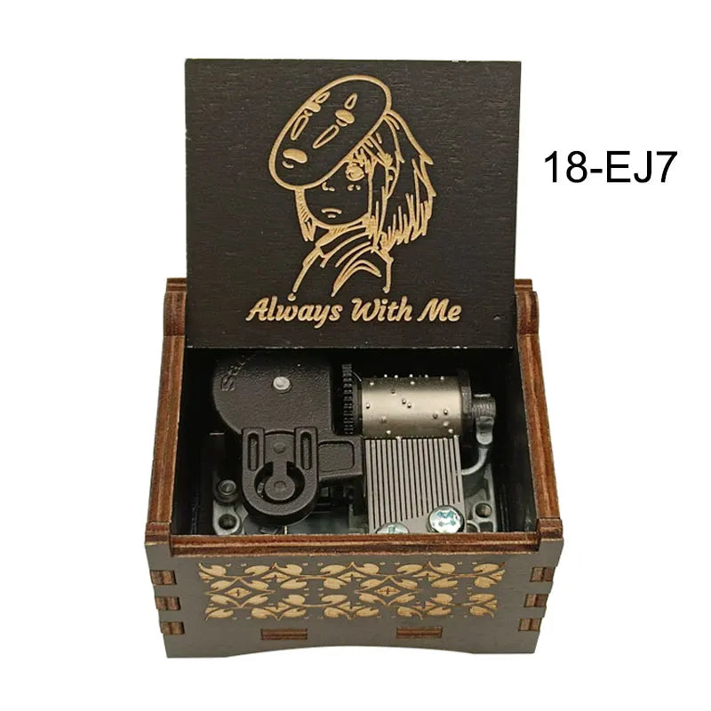 A dark wooden box containing a mechanical music box with an anime-style character design.