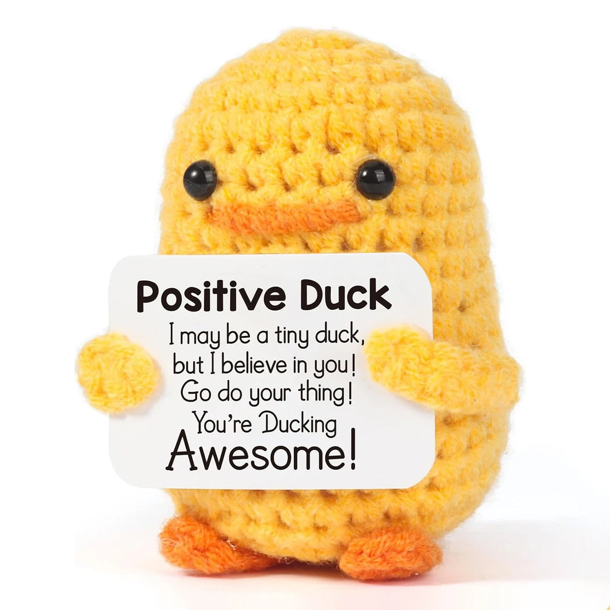 A yellow hand-woven duck plush toy with black eyes and an encouraging card.