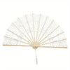 Elegant hollowout lace handheld fan in beige color with a delicate pattern