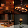 A black pearled candle with wicks is shown in various settings, including on a wooden box and glass holder.