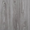Close-up of gray wood grain wall tiles with vertical striations.